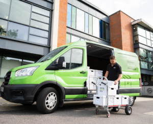 Image of a document management specialist providing a document storage solution to a customer in Surrey