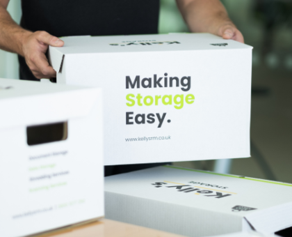 Image Kelly's staff bringing customers items to there office in Kelly's provided boxes